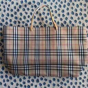 Burberry coated canvas tote. Good used condition with signs of wear. See pics.